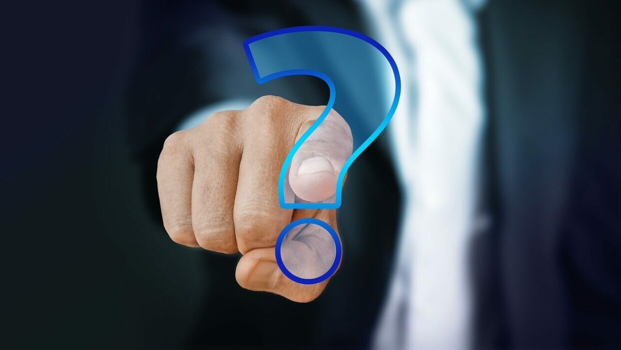 hand pointing at you with a question mark